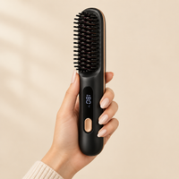 SwishBrush Pro held in hand showing its compact size